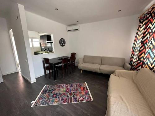 a living room with a couch and a table at Casa Vallromanes Rest House in Vallromanas