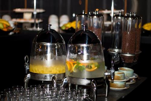 two containers with food in them on a table at Alliance Palace Marriott in Batumi