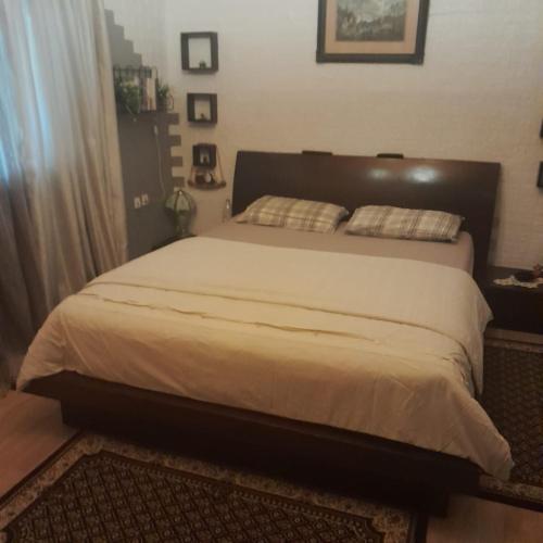 a bedroom with a large bed in a room at Sarah Delight in Pýrgos