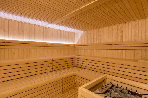 a large wooden sauna with a light on the ceiling at Four Points by Sheraton Costa Blanca Resort in Benidorm
