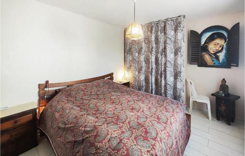 a bedroom with a bed with a red bedspread at Beautiful Home In Servian in Servian