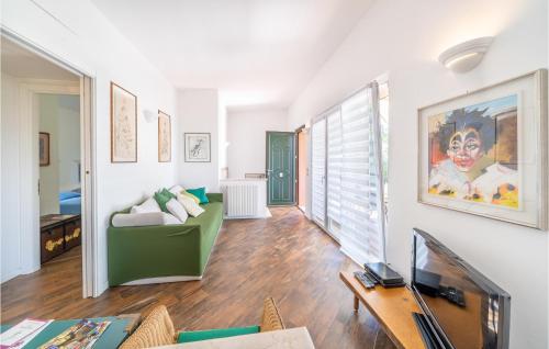 a living room with a couch and a table at Villa Liselote in Gargnano