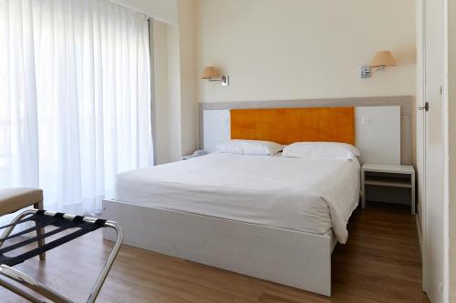 Katil atau katil-katil dalam bilik di Hôtel Le Dauphin