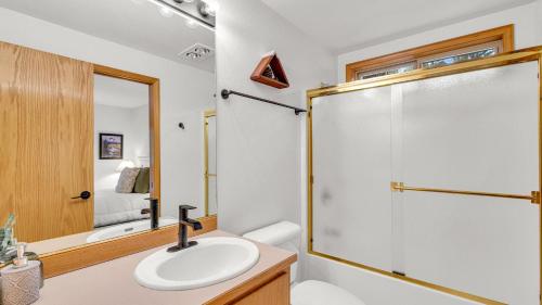 a bathroom with a sink and a shower at Rager Mountain - Unit 10 in Sunriver