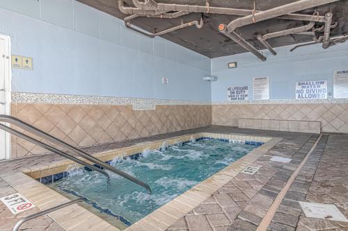 a swimming pool with two metal poles in it at Atlantica 1055 in Myrtle Beach