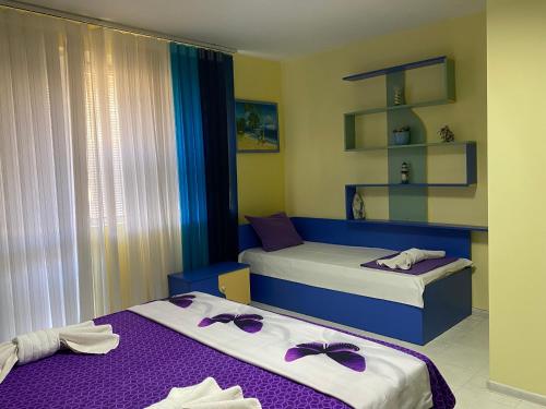 Postel nebo postele na pokoji v ubytování GALA APARTMENT
