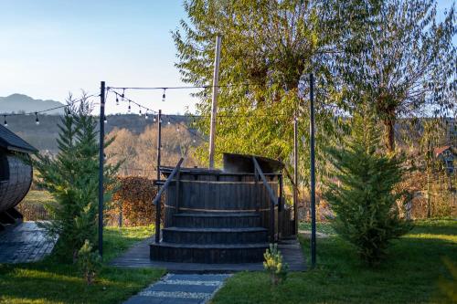 a set of stairs in a yard with trees at Glamp In Style Pods Resort in Bran