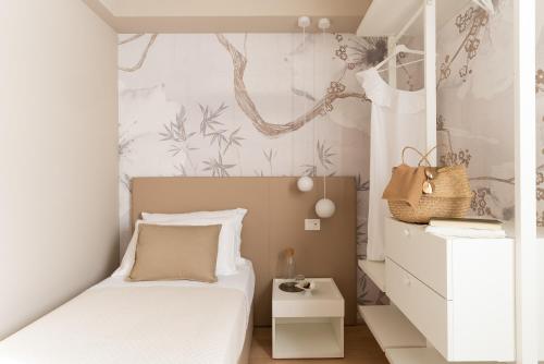 Postel nebo postele na pokoji v ubytování Dimora Bramante Rooms
