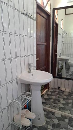 a bathroom with a sink and a mirror at Cozy breezing countryside Pet in Ban Khlong Sip Sam Lang