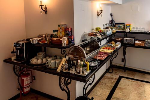 a buffet line with food on a table at Vila SaraDa Boutique in Deva