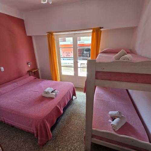 Ένα ή περισσότερα κρεβάτια σε δωμάτιο στο Hotel Nuevo Splendid en la Peatonal