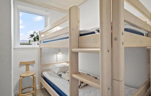 a bunk bed room with two bunk beds and a desk at Four-Bedroom Holiday Home In Middelfart in Middelfart