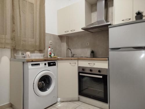 Kuchyň nebo kuchyňský kout v ubytování KELLY APARTMENTS
