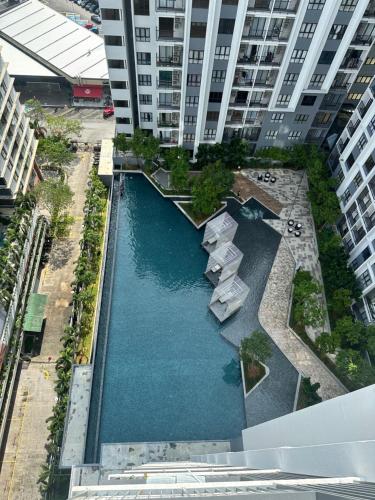 an overhead view of a swimming pool in a building at MUJI 3BEDROOM HOME SHAH ALAM CITY - NEAR MSUitm in Shah Alam
