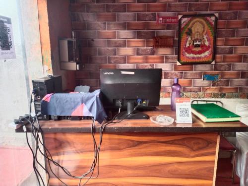 a desk with a computer on top of it at New paradise hotel &restaurant in Alwar