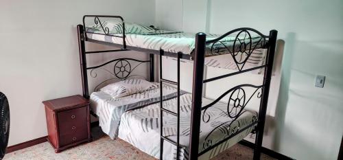 a couple of bunk beds in a room at Acogedor Apto Al Lado Del Parque Del Ingenio in Cali
