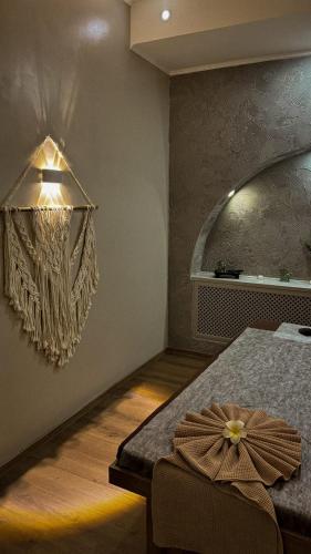a bedroom with a bed and a large mirror at Medeu in Kostanay