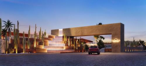 a car is parked in front of a building at Secrets Baby Beach Aruba Adults Only in Ceru Colorado