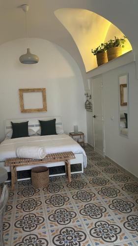 a bedroom with a large bed with a rug at Vicolo 4 Locazione Turistica in Monopoli