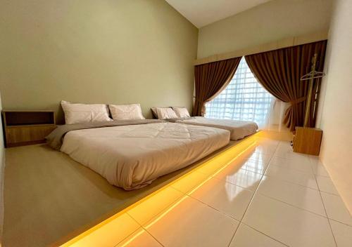 Ένα ή περισσότερα κρεβάτια σε δωμάτιο στο Polo Stay, 4 bedroom Single Storey house Ipoh for 10 pax
