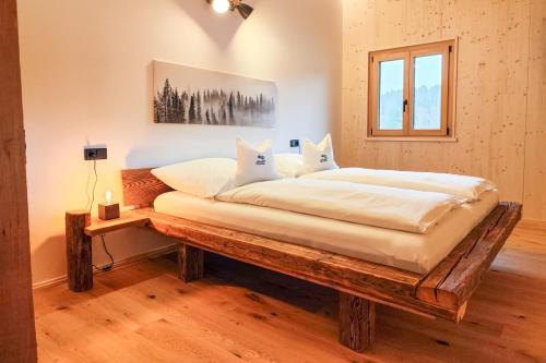 Postel nebo postele na pokoji v ubytování Chalet Flanitzmühle