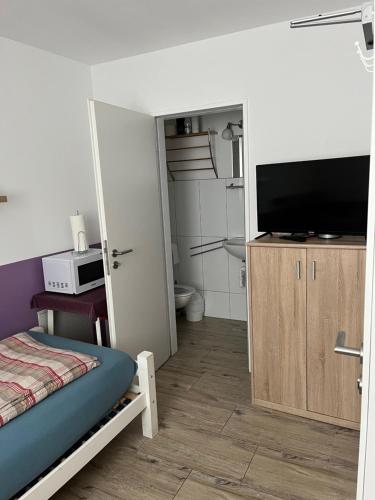 TV a/nebo společenská místnost v ubytování Fremdenzimmer Sas