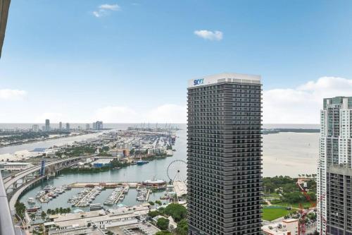 a view of a river and a city with tall buildings at NEW Luxury Bay View Downtown 1 Bedroom in Miami