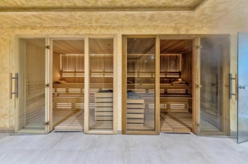 an empty closet with glass doors at Monte Relax - Wellness Oase in Zlatibor