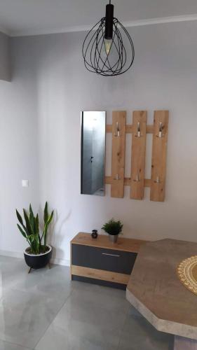 a bedroom with a table and a mirror on the wall at Modern & Charming Mitilini in Mytilene