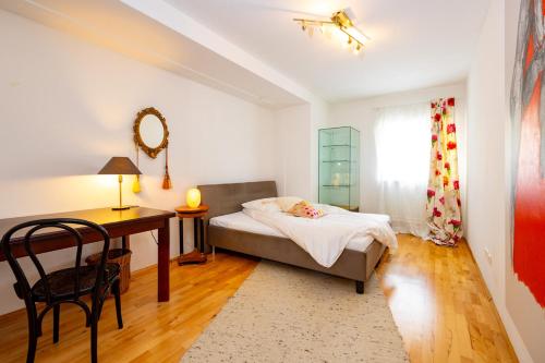 Postel nebo postele na pokoji v ubytování Ferienwohnung am Badesee