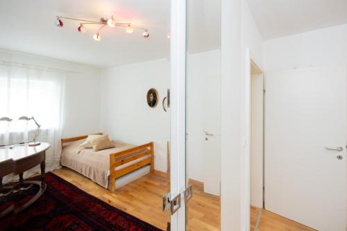 Postel nebo postele na pokoji v ubytování Ferienwohnung am Badesee