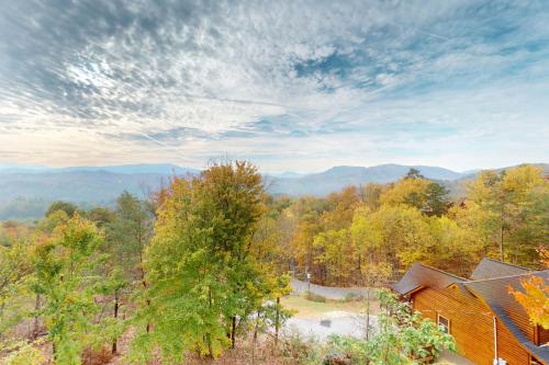 an overhead view of a house in the mountains with trees at Million Dollar View Cabin in Dupont Springs
