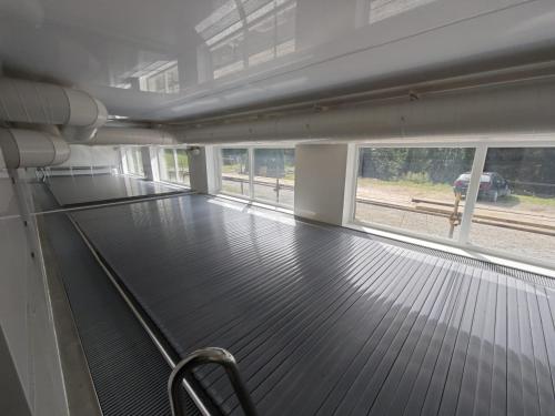 a empty room with a train on the tracks at Horská chata Severka in Dolní Lomná