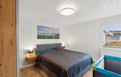 a bedroom with a bed and a window at Amazing Home In Wandlitz Ot Zerpenschl in Berg