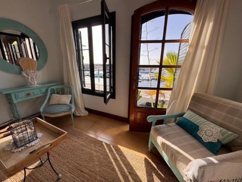 a living room with a couch and a table at Eslanzarote Casa Eneida sea views, super wifi in Tías