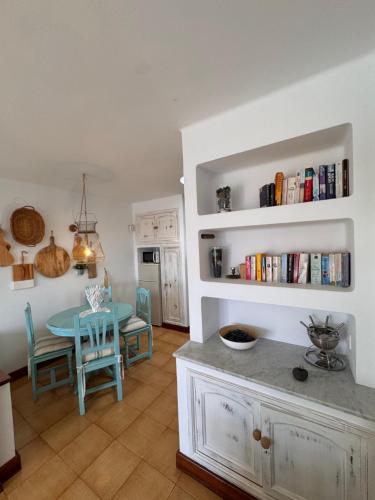 a kitchen and dining room with a table and chairs at Eslanzarote Casa Eneida sea views, super wifi in Tías