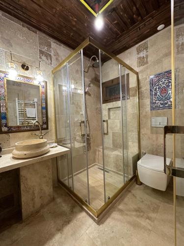 a bathroom with a shower and a sink and a toilet at Saint Johns Hill Boutique Ephesus in Selcuk