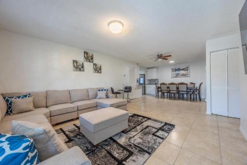 a living room with a couch and a table at Peaceful in Royal Palm Beach