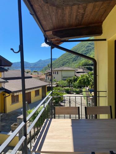 a view from the balcony of a house with a table and chairs at Casa Nigritella in Ornavasso