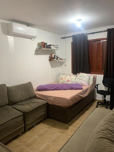 Ένα ή περισσότερα κρεβάτια σε δωμάτιο στο Casa de passeio com piscina