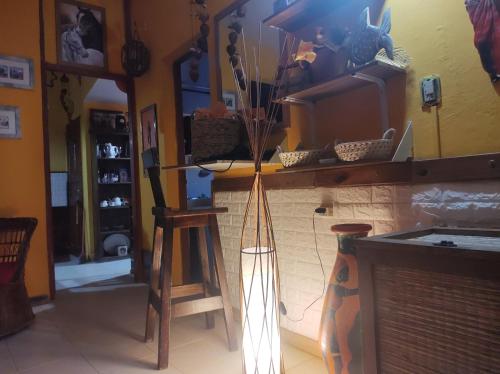 a room with a counter with a mirror and a stool at El REFUGIO DE KARIM in San Rafael