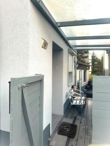 an open door on a porch with a deck at Ferienwohnung Bina in Trier