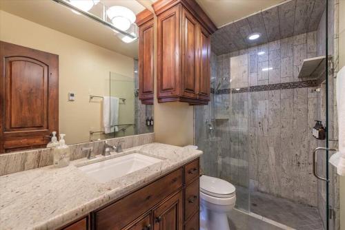 a bathroom with a sink and a toilet and a shower at Luxury 3 BDR Northstar Condo in Truckee