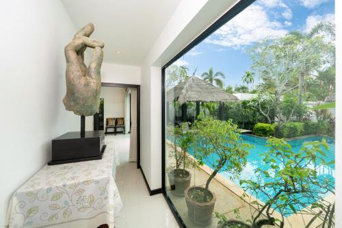 a view of the pool from the living room of a villa at Laguna luxury pool villa 3 bedroom in Phuket