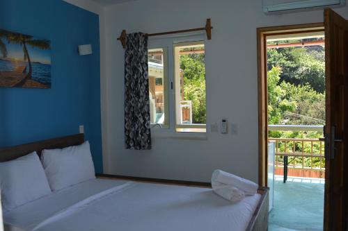 Ένα ή περισσότερα κρεβάτια σε δωμάτιο στο Hotel Cristal Mazunte