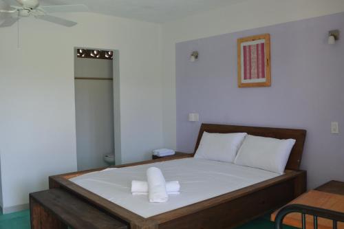Ένα ή περισσότερα κρεβάτια σε δωμάτιο στο Hotel Cristal Mazunte