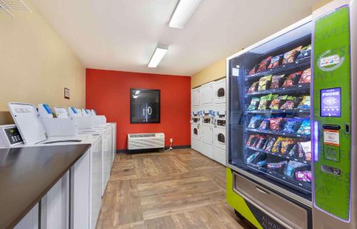 a store aisle with a soda machine in a store at Extended Stay America Suites - Austin - Round Rock - South in Round Rock