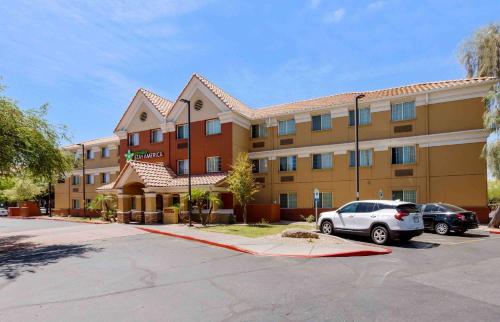 a hotel with a car parked in a parking lot at Extended Stay America Suites - Phoenix - Airport - Tempe in Tempe