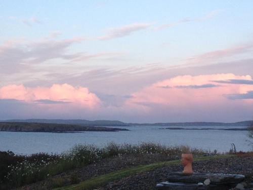 a view of a body of water at sunset at Rock Hill House in Schull