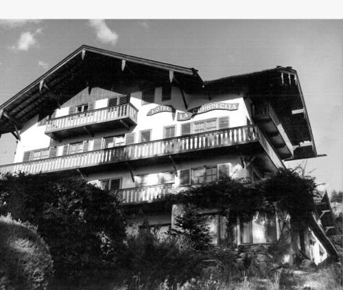 a large building with balconies on top of it at Hotel La Cumbrecita in La Cumbrecita
